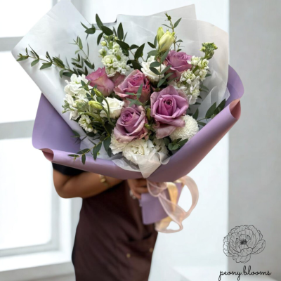 Elegant purple roses bouquet with rich tones